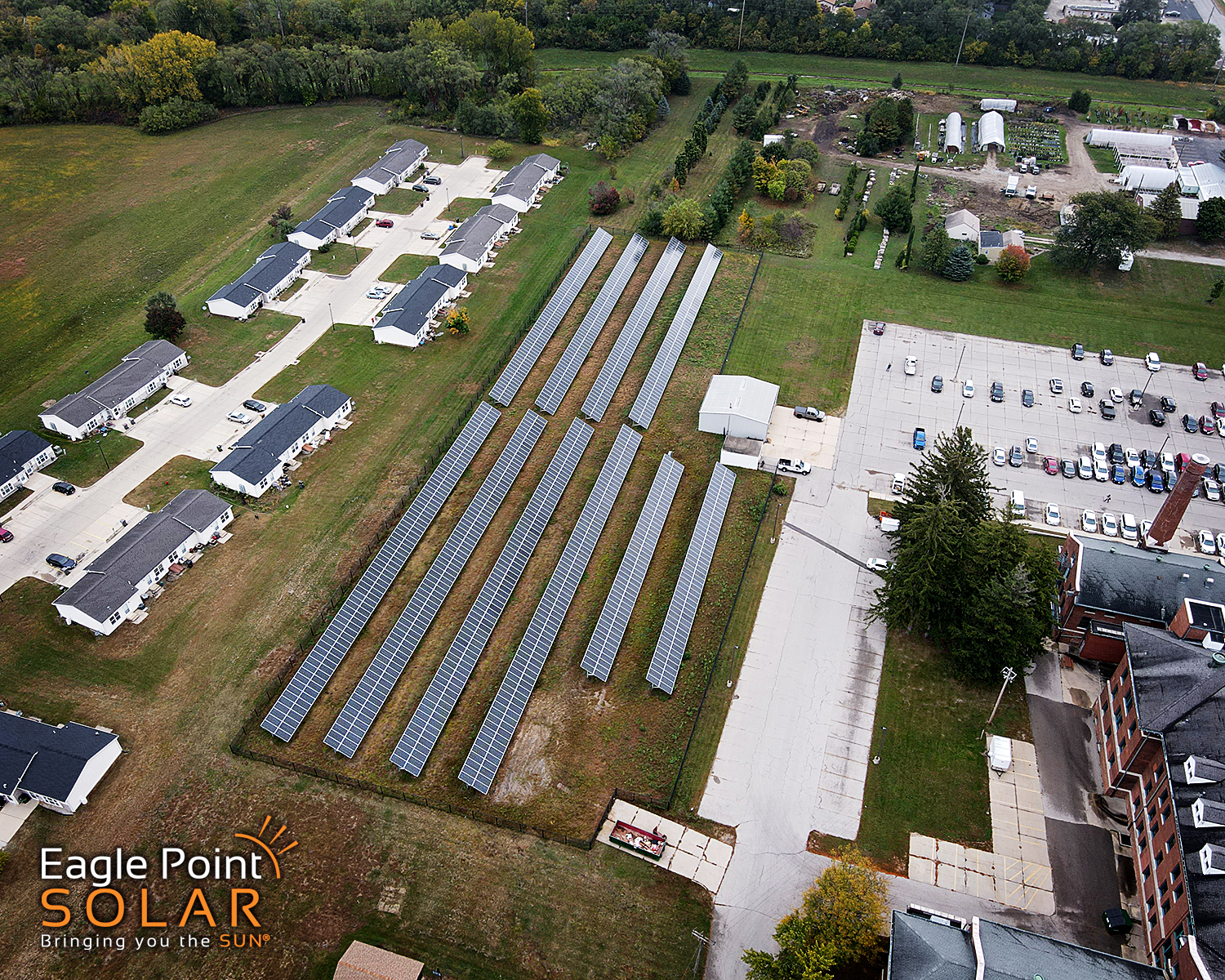 aerial view of Blackhawk County Pinecrest with rows of solar panels installed in the ground