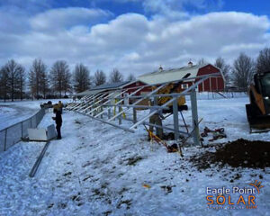 eagle point solar technicians installing solar panels in the winter