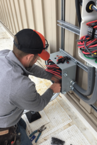 An Eagle Point Solar technician taking readings.