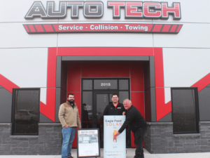 Image showing Auto Tech with the Eagle Point solar staff.