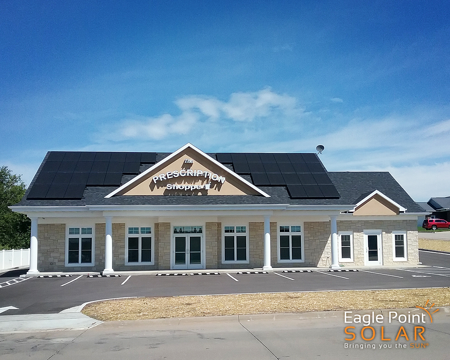 Solar panels installed on the roof of a pharmacy