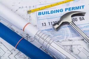An illustration showing plans and a building permit, often used by a professional solar installer.