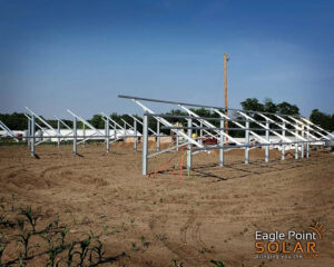 Ground array solar mounts sit on in a field awaiting solar panels to be installed on them.