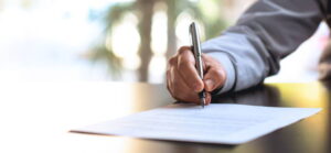 Person signing a contract